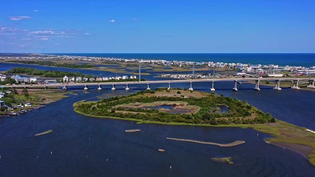 Large bridge over the water in Jacksonville, NC, Surf City Bridge. Sunny day. Blue sky