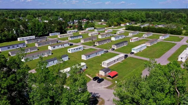 American headquarters longhouses. Surrounded by woods and American flag. Hubert, North Carolina. Drone aerial shot. 