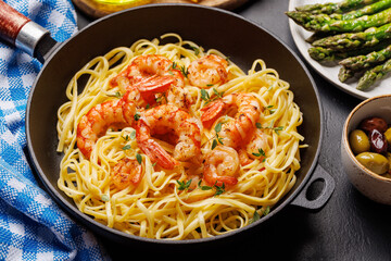 A delightful Italian pasta adorned with shrimps