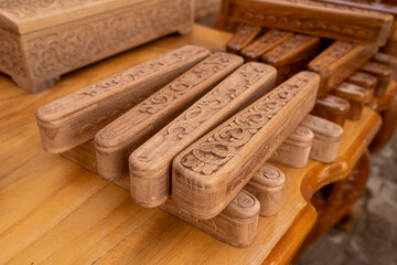 a wooden storage book with design