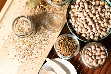 small jar with quinoa on rustic table top view. Healthy food and snack.