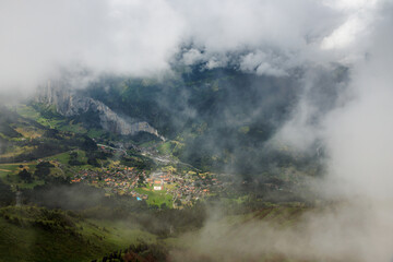 view from Männlichen through clouds on Wengen in Lauterbrunnen valley