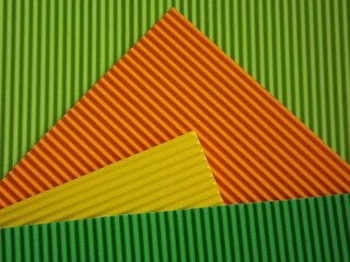 The corrugated surface is multicolored with parallel lines as a background black blue orange...