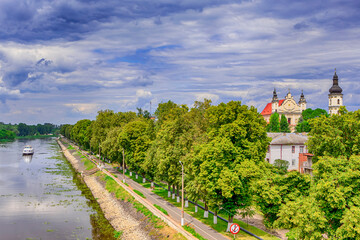 Fototapeta na wymiar Bell tower of Cathedral of Assumption of Virgin Mary in Pinsk of Brest Region Of Belarus In The Polessie Region With The Pina River Skyline In Summer