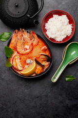 Traditional Thai soup Tom Yum and rice bowl