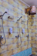 Shower Cabins in Banya Or Bath Interior with Bucket of Cold Water for Dousing.