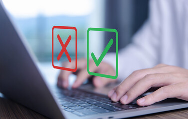 Businessman using smartphones show right and wrong symbols. yes or no decision	
