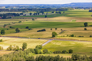 Fototapeta premium Crossroad on a country road in a rural landscape view