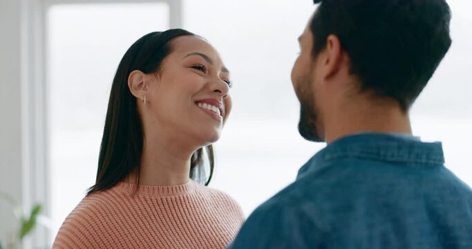 Woman, man and kiss on forehead in home for love, care or quality time together in happy relationship. Face of couple kissing in romance, smile and loyalty in marriage, trust or commitment of support