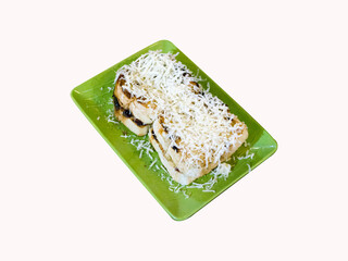 top view of brown cheese toast in a green tin isolated white background