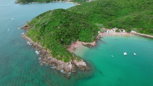 Aerial orbiting shot over idyllic turquoise Azeda and Azedinha beach, B&uacute;zios