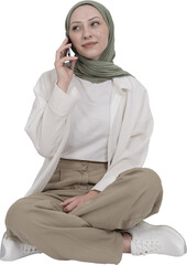 Full body view woman wearing hijab talking on the phone sitting on the ground isolated transparent...