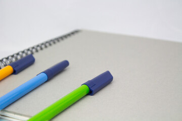 notebook and pen on a white background