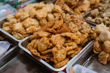 mix of traditional cuisine from street food vendor. deep fried banana