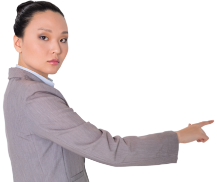 Digital png photo of serious asian businesswoman pointing finger on transparent background