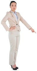 Digital png photo of serious asian businesswoman pointing finger on transparent background