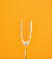 One empty glass for wine, champagne or other alcoholic beverages at a party or club in beautiful shape. Celebration alcohol party.