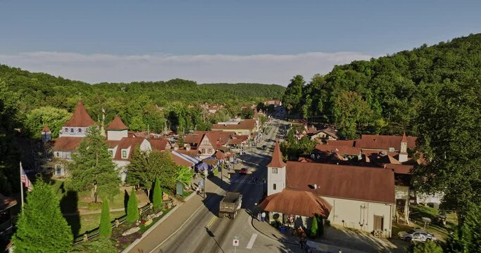 Helen Georgia Aerial v8 cinematic low drone flyover small mountain town along the main street capturing charming Bavarian-style architectures and lush greenery - Shot with Mavic 3 Cine - October 2022