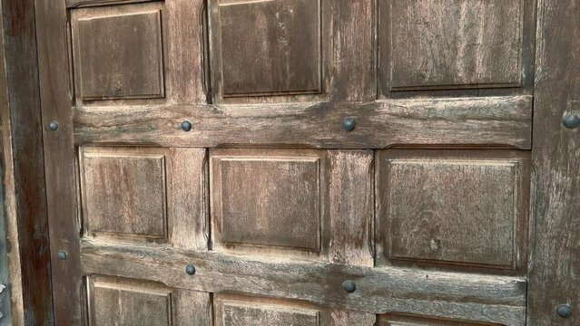 Large brown antique wooden door