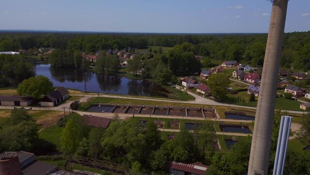 Amazing aerial top view flight Chimne, 
Solar field plant factory at village Chlum, Czech Republic Summer 2023. fly reverse drone
4K Cinematic.