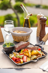 Grilled pork chops with roasted vegetables