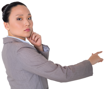 Digital png photo of serous asian businesswoman showing index finger on transparent background