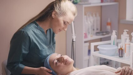 Cosmetologist checking clients skin condition after dermatitis treatment course