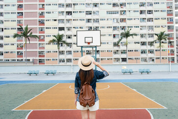 A woman tourist is enjoy traveling at choi hung housing estate famous hipster travel landmark new location in Hong Kong.