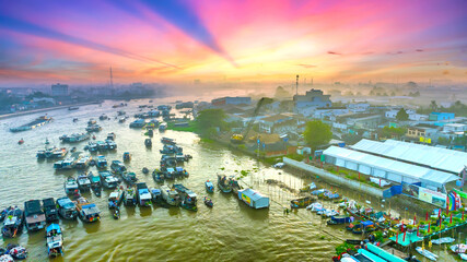 Cai Rang floating market, Can Tho, Vietnam, aerial view, sunrise background. Cai Rang is famous market in mekong delta, Vietnam.
