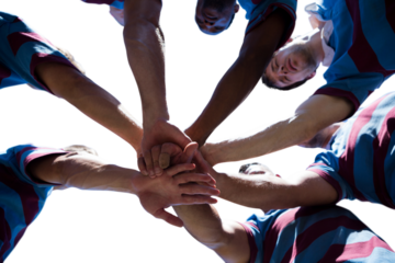 Digital png photo of diverse male rugby players teaming up on transparent background