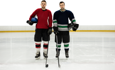 Digital png photo of two caucasian hockey players standing on hockey field on transparent background