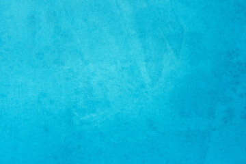 Blue light concrete texture for background in summer wallpaper. Cyan cement colour sand wall of tone vintage. Abstract teal dark color.