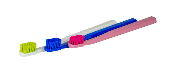 New toothbrushes - red, white and blue - isolated - side view