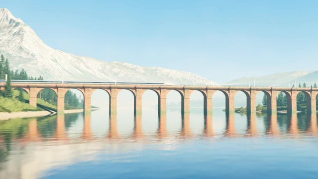 Bullet train crossing bridge over the water with view of mountains and forest