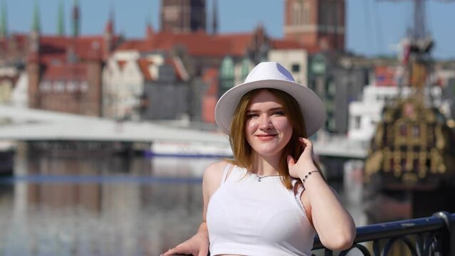 girl in a white hat on the background of Gdansk Europe Poland