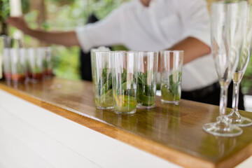 Mojito cocktail  in glasses at the bar counter - close up