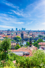 Vertical cityscape of Prague mixing old town and new skyscrapers in the background