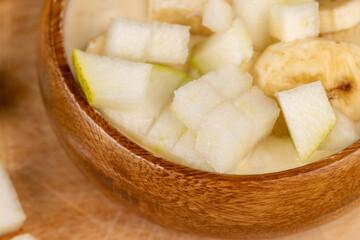 fresh yogurt made from milk with slices of fresh banana