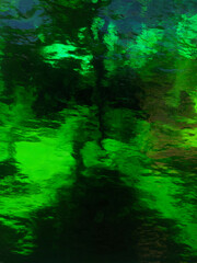 green glass. abstract blurred background.