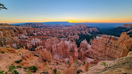 Aerial sunrise view of impressive hoodoo sandstone rock formations in Bryce Canyon National Park,...