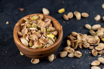 a large number of salty and crispy pistachios close-up