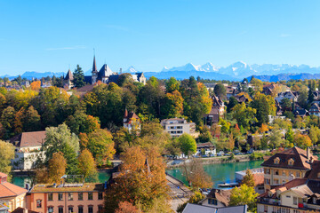 View of Bern city and the Bern History Museum at autumn with the Swiss Alps in the background