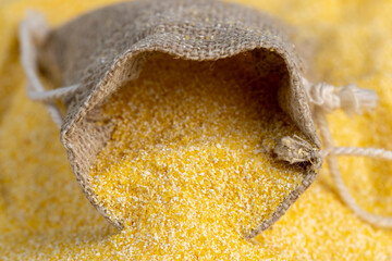 Linen bag of small size with dry corn flour for cooking porridge