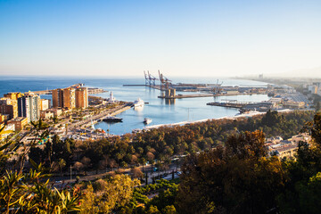 Obraz premium view over Malaga at sunset travel banner