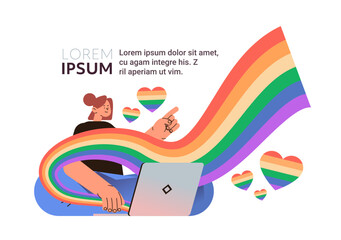 woman with lgbt rainbow flags using laptop gay lesbian love parade pride festival transgender love concept