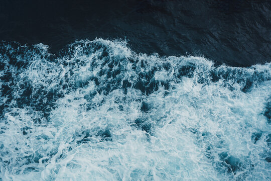 View from above turquoise ocean waves background. © bignai