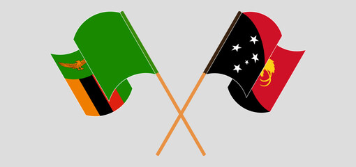 Crossed and waving flags of Zambia and Papua New Guinea