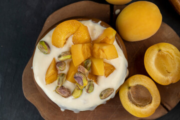 fresh yogurt with taste and chunks of yellow apricot