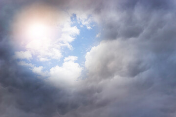 heart in the sky among the clouds. Sunlight in a cloudy sky in the shape of a heart. Beautiful love background with copy space.