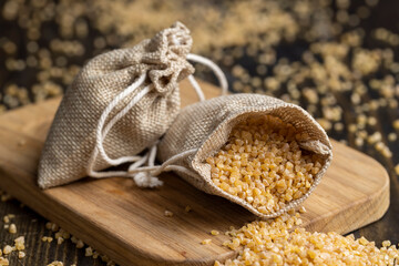 Not cooked wheat porridge in a linen bag